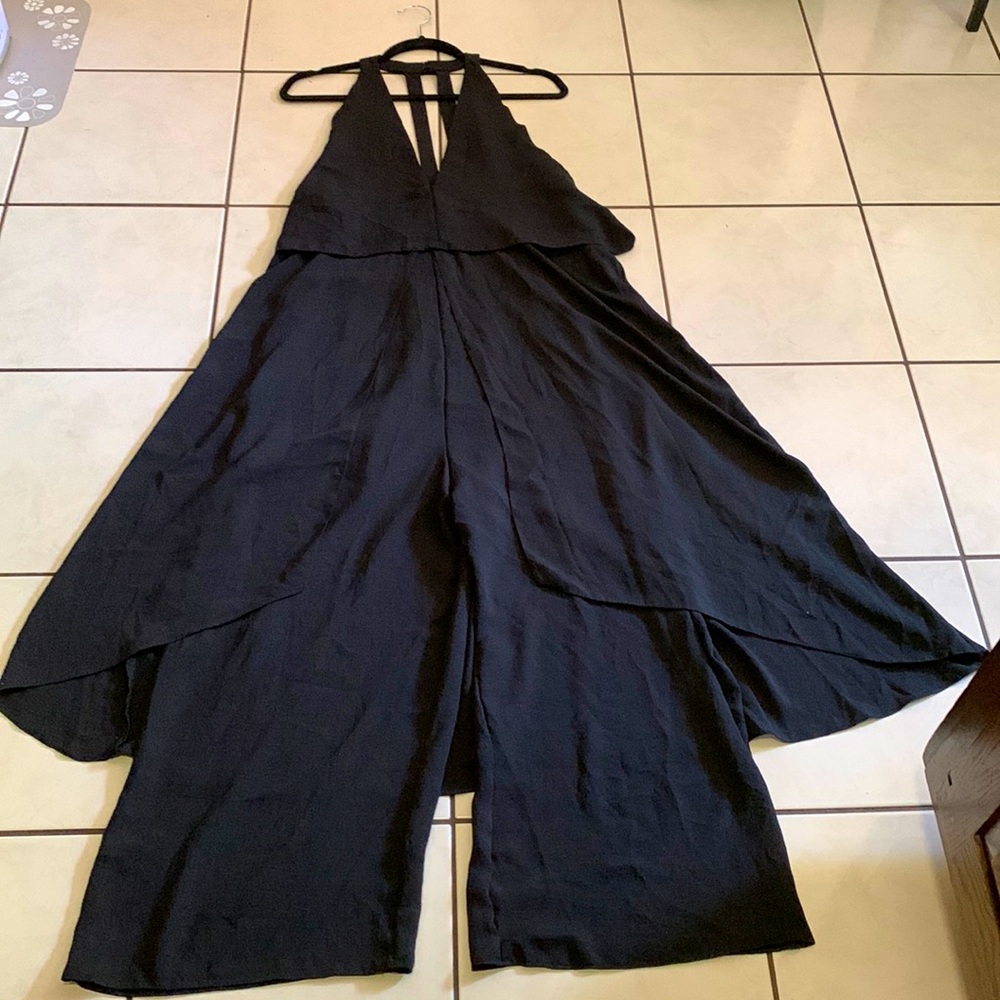 Black jumpsuit by ASOS in good NWT condition. Fits size 14 US. Very flattering.